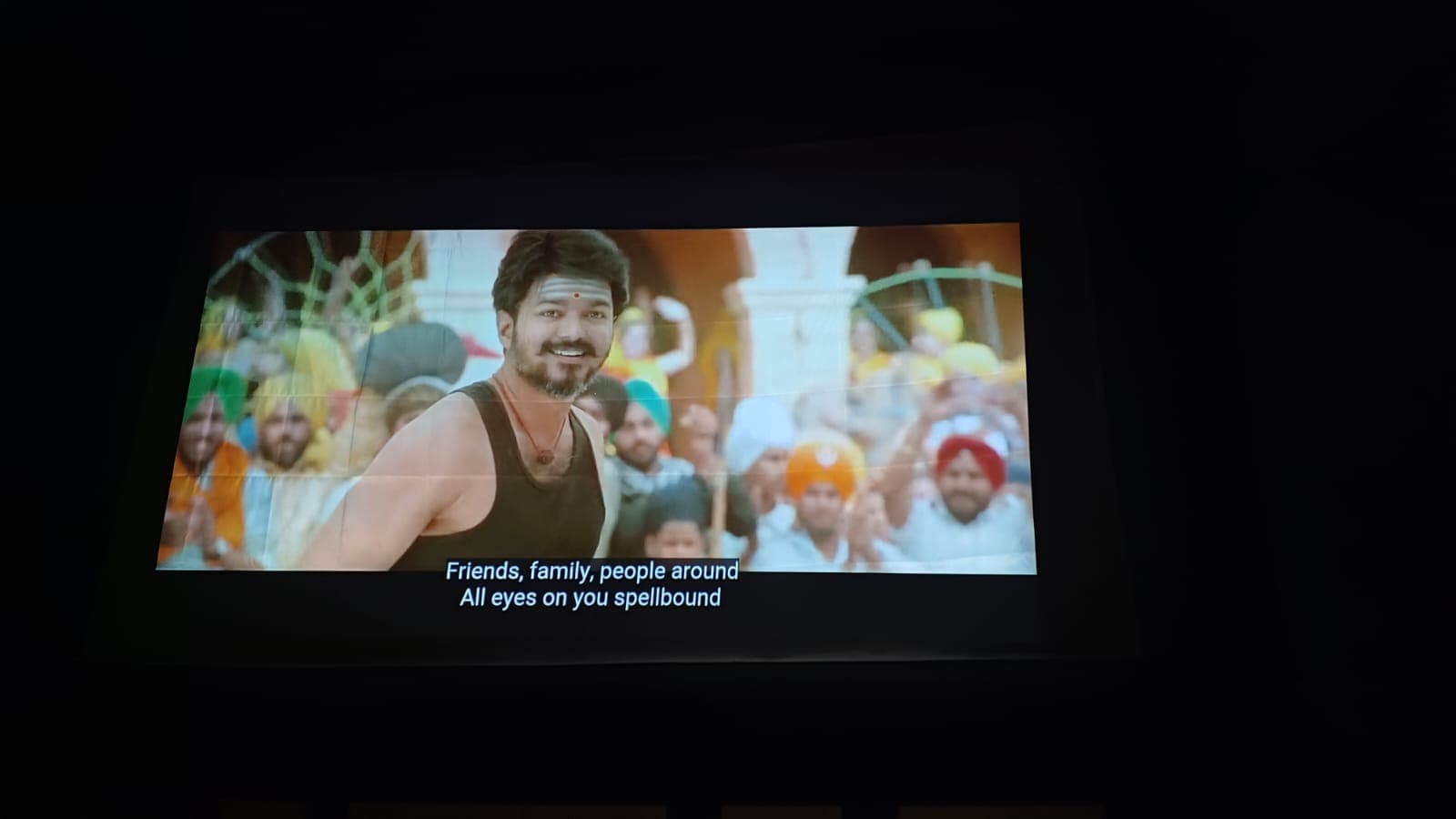 Outdoor cinema screening — movie scene projected on inflatable screen